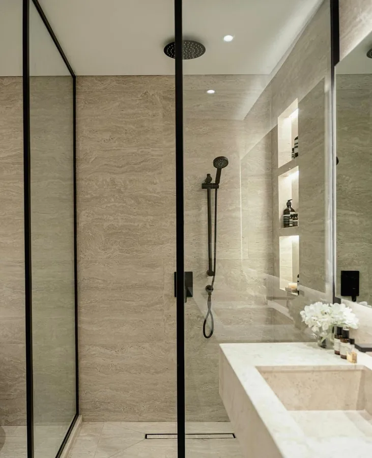 Frameless glass shower enclosure with black aluminium posts
