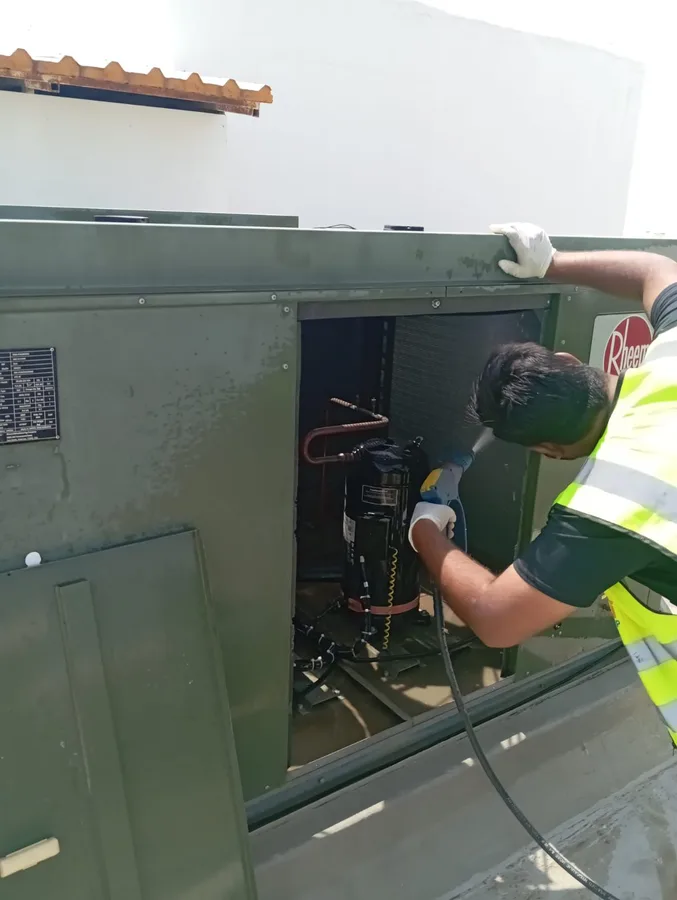 FixUp Fab technicians manoeuvring a large glass panel into position